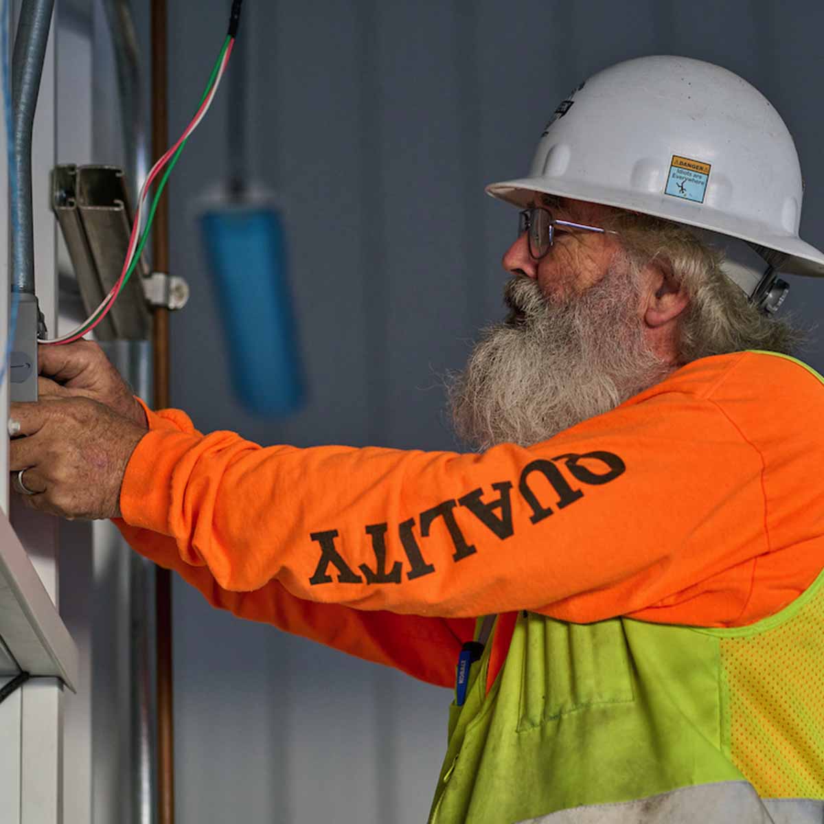 Journeymen installing a junction box.